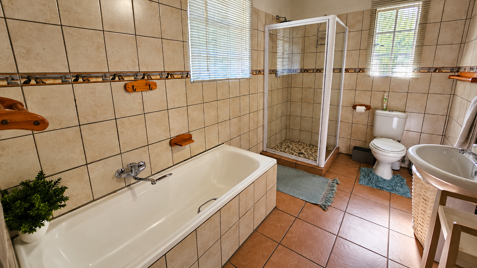 Baby Lodge bathroom with bath and shower
