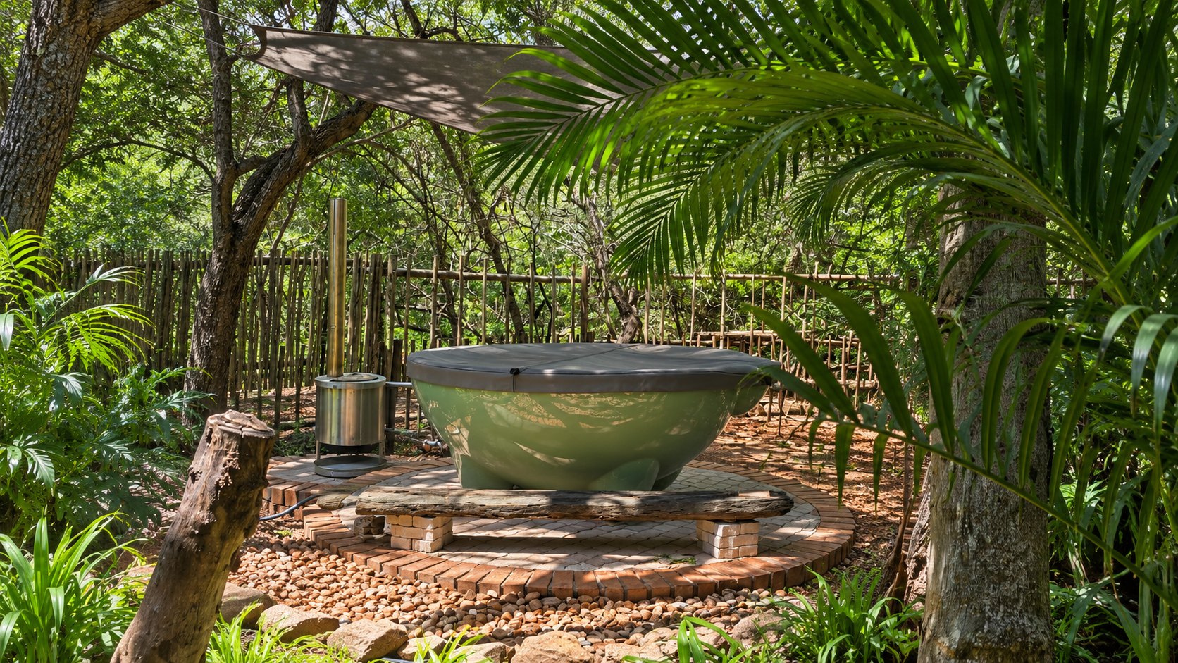 Baby Lodge outdoor hot tub surrounded by greenery