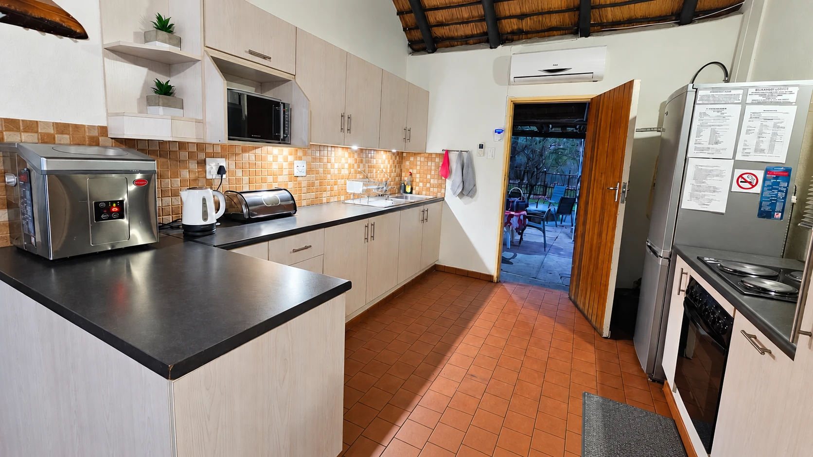 Bush Lodge kitchen with fridge and counter space