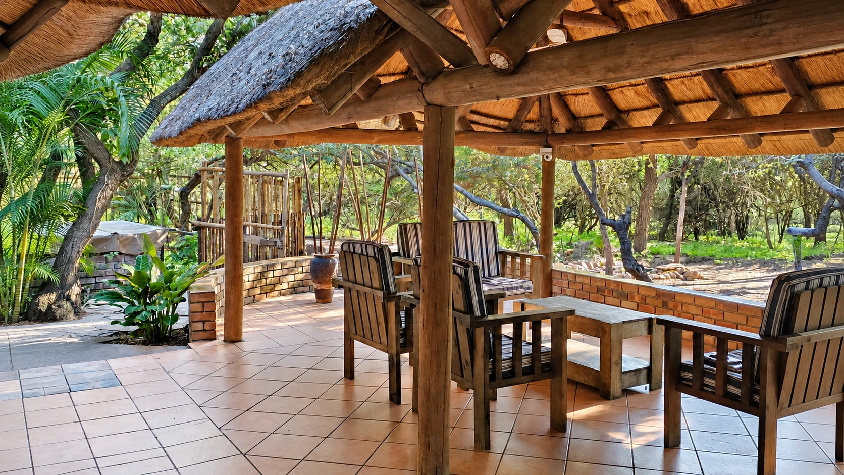 Thatched lapa with dining and seating areas